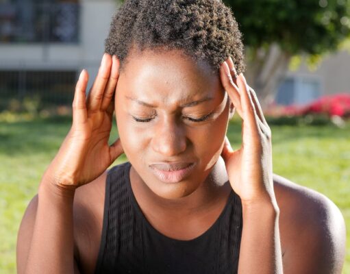 Migraine treatment at home woman in pain due to headache