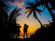 Top 10 Romantic Travel Getaways Silhouette of Man and Woman Kissing
