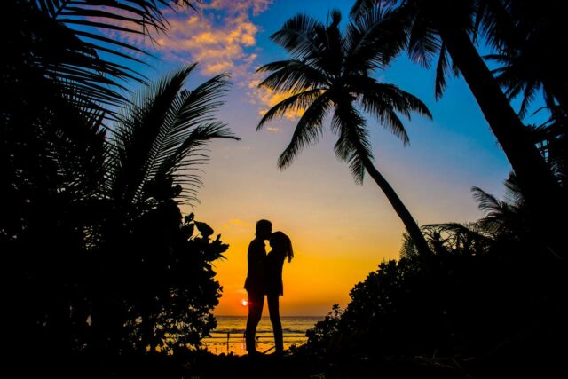Photo by Asad Photo Maldives Silhouette of Man and Woman Kissing