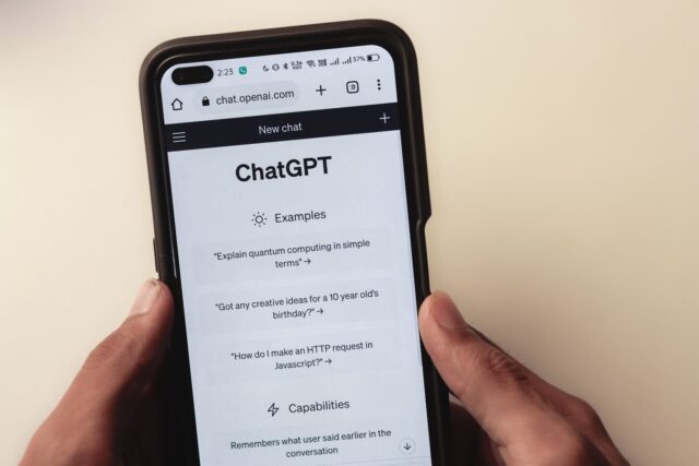 Photo by Sanket Mishra Webpage of ChatGPT, a prototype AI chatbot, is seen on the website of OpenAI, on a smartphone. Examples, capabilities, and limitations are shown.