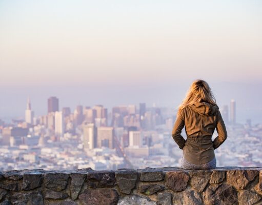 Top 10 Ways to Overcome Travel Anxiety blonde, sitting, wall