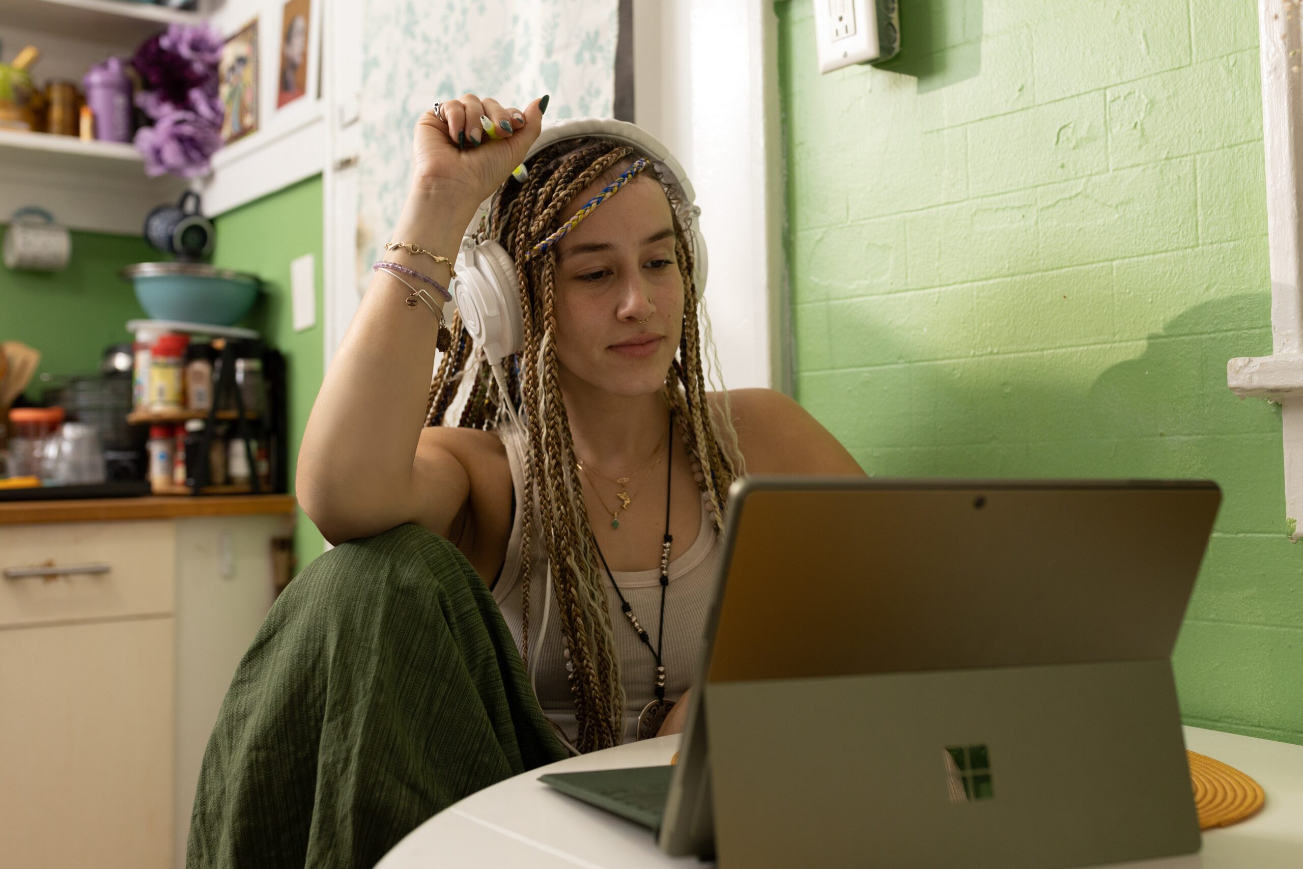 Top 10 Creative Tech Gadgets You Didn’t Know You Needed a woman with dreadlocks sitting in front of a laptop computer