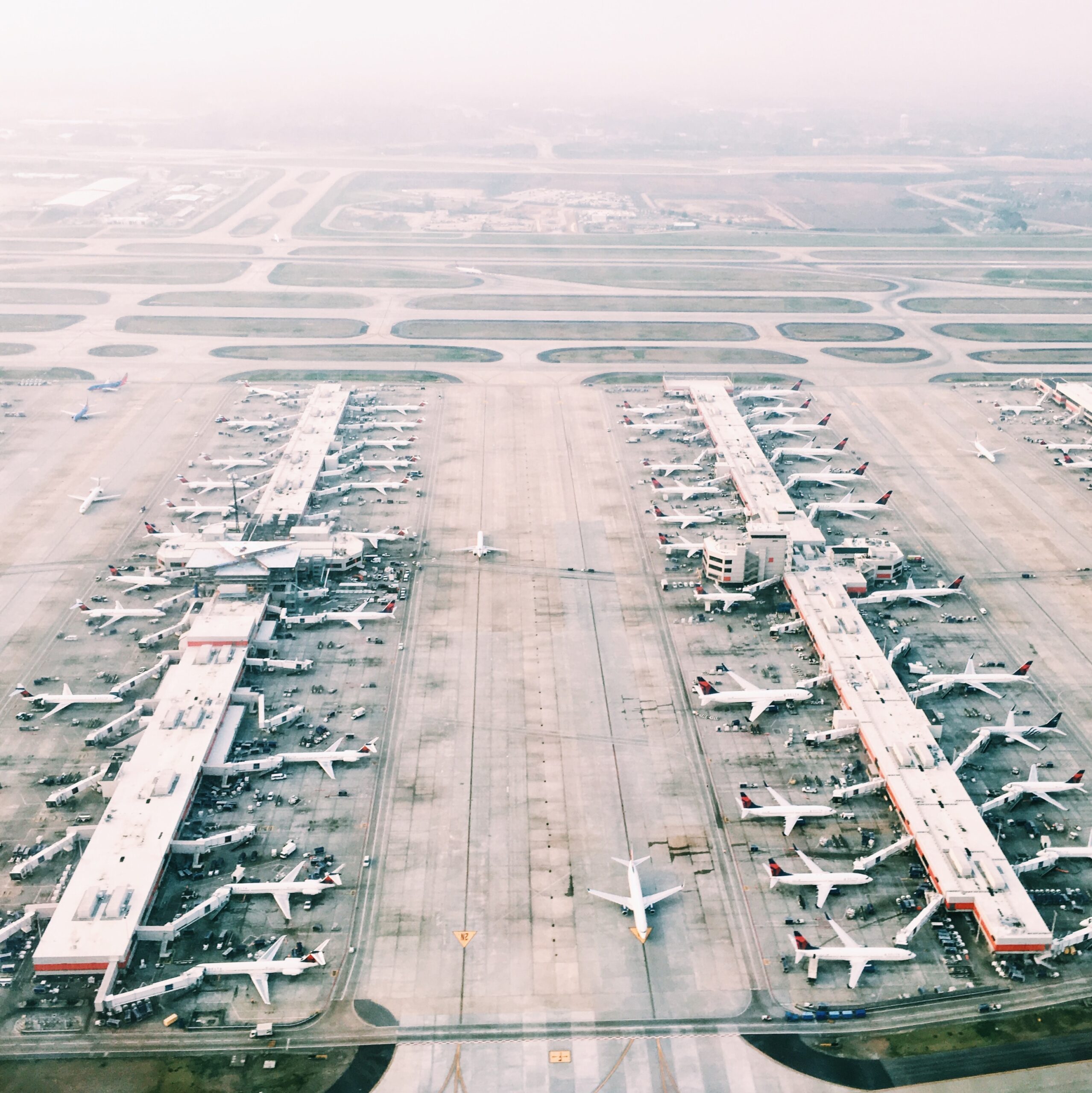 aerial view of airport aerial view of airport with lots of airplanes during daytime