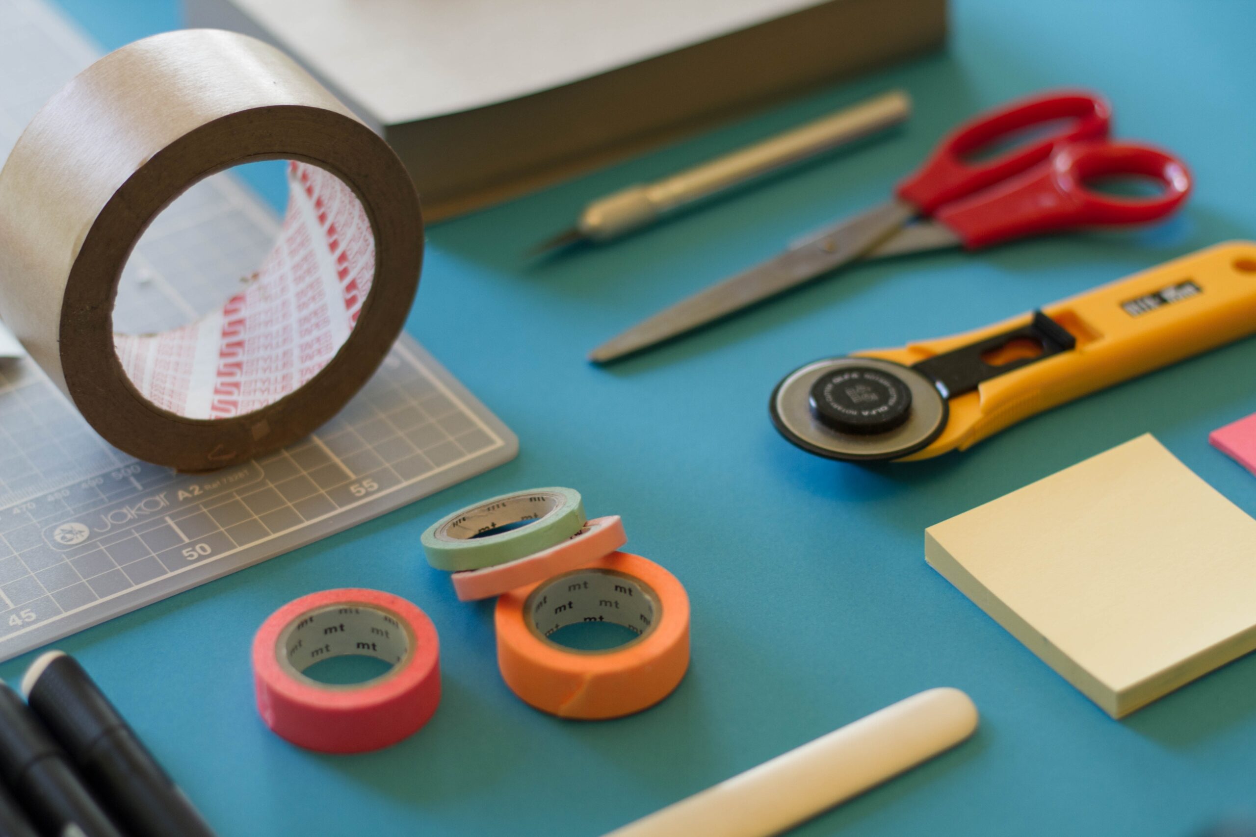 assorted-color office items on assorted-color office items on table