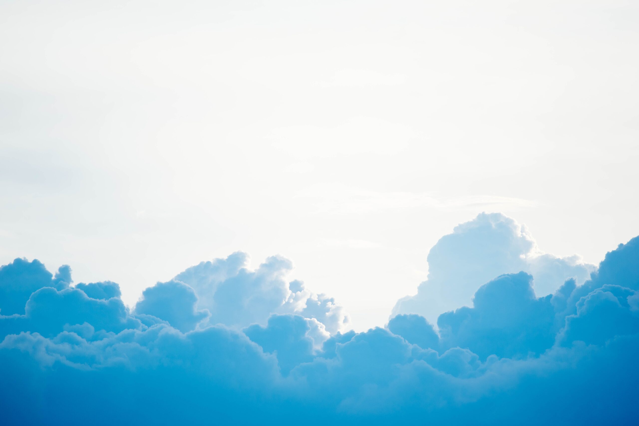 blue clouds under white blue clouds under white sky