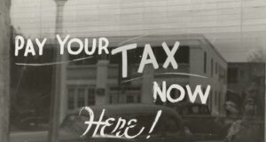 Top 10 Tax Deductions for Self-Employed Workers in the United States a sign that says pay your tax now here