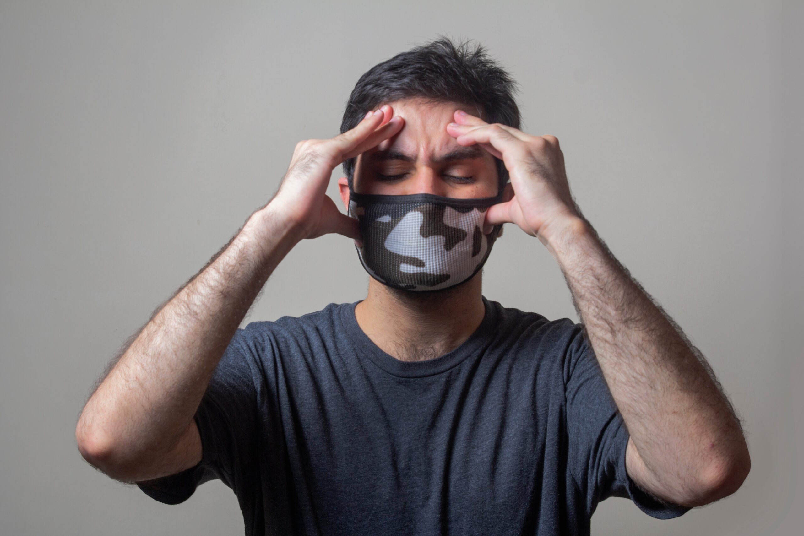 man in black crew man in black crew neck t-shirt wearing black and white mask