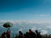 Top 10 Adventure Travel Activities people on top of hill