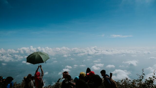 Photo by Falaq Lazuardi people on top of hill