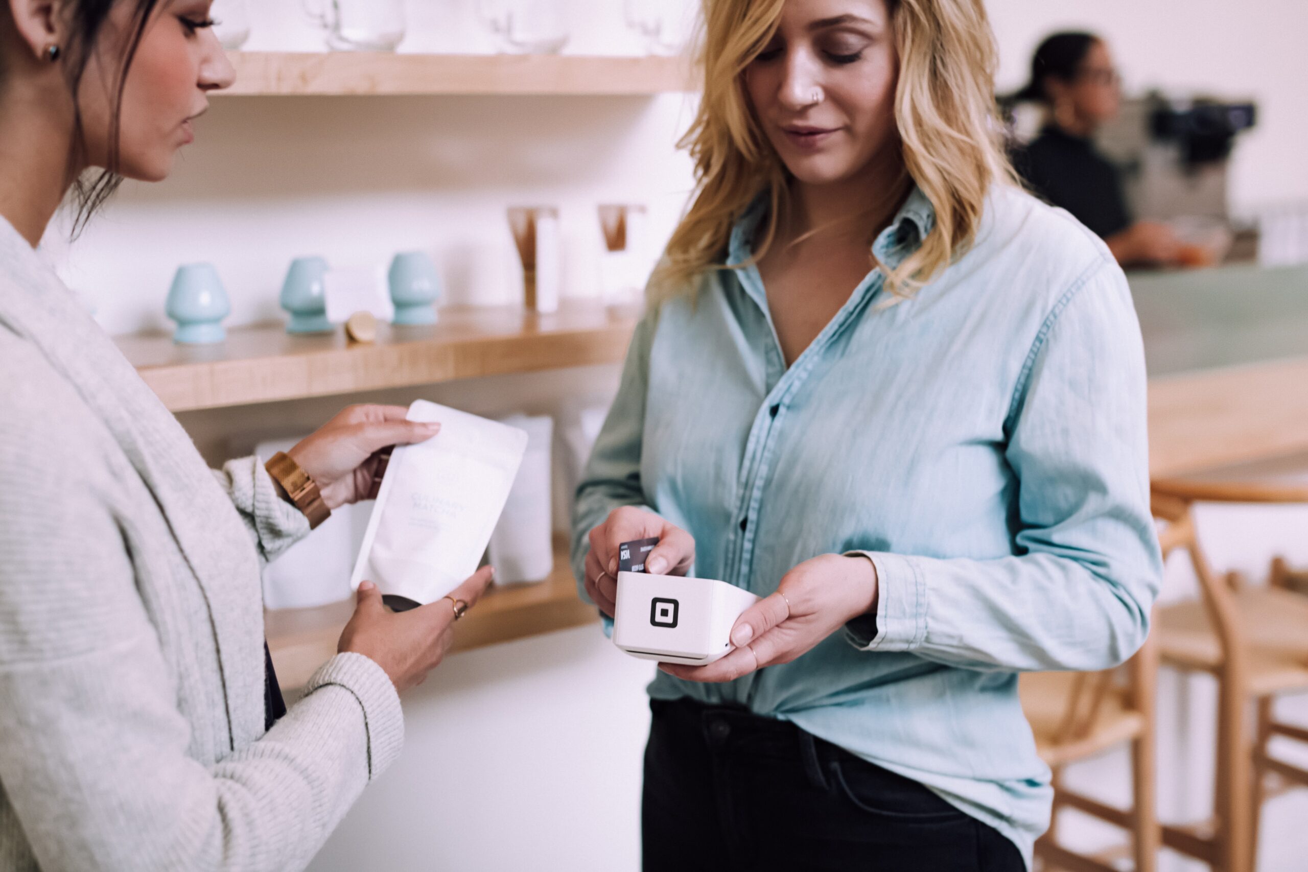 woman holding white pack woman holding white pack
